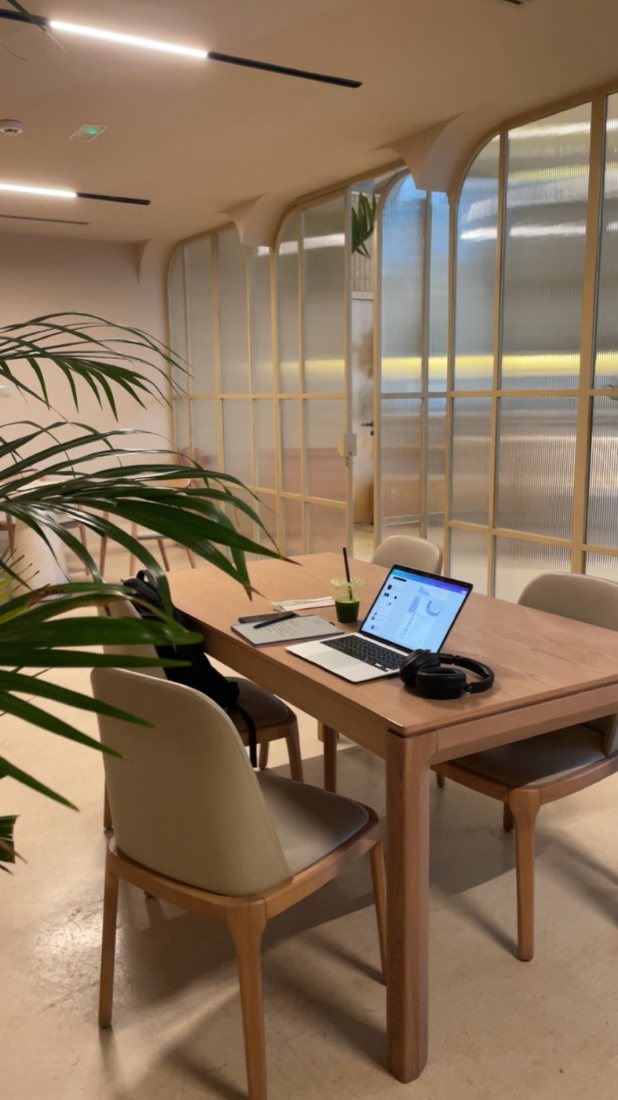 Work, laptop and matcha at a quiet table